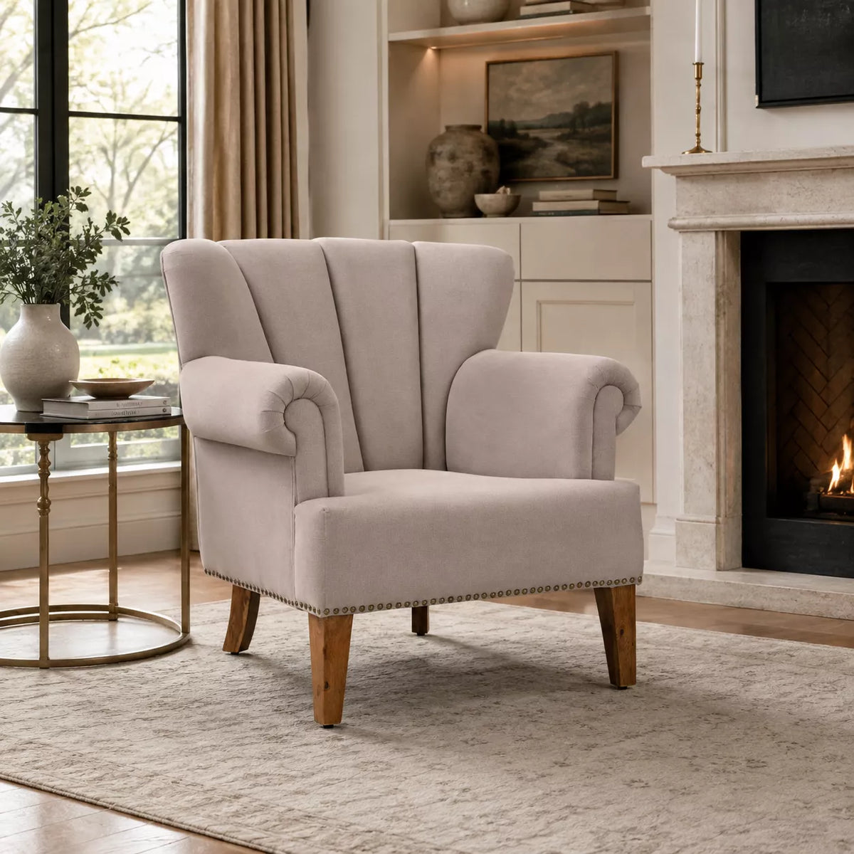 Beige wingback accent chair with rolled arms in a premium US living room interior