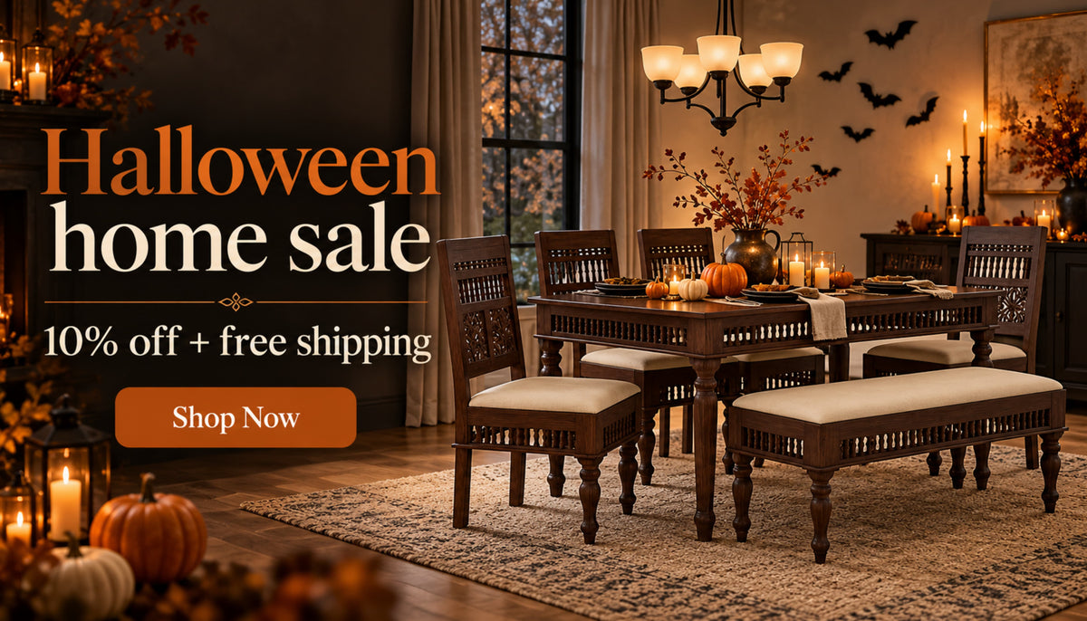 Halloween home sale banner with a carved wooden dining table, chairs and upholstered bench amid autumn décor. Get 10% off plus free shipping.