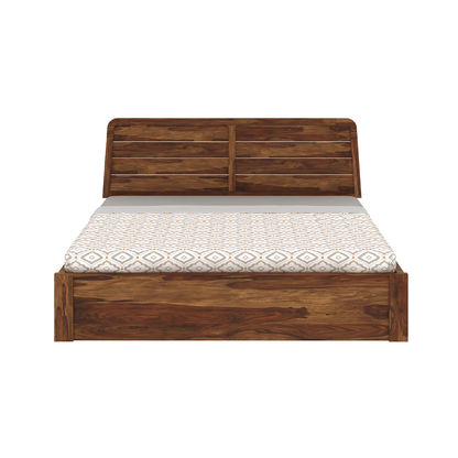 Wooden bed with a patterned mattress on a white background