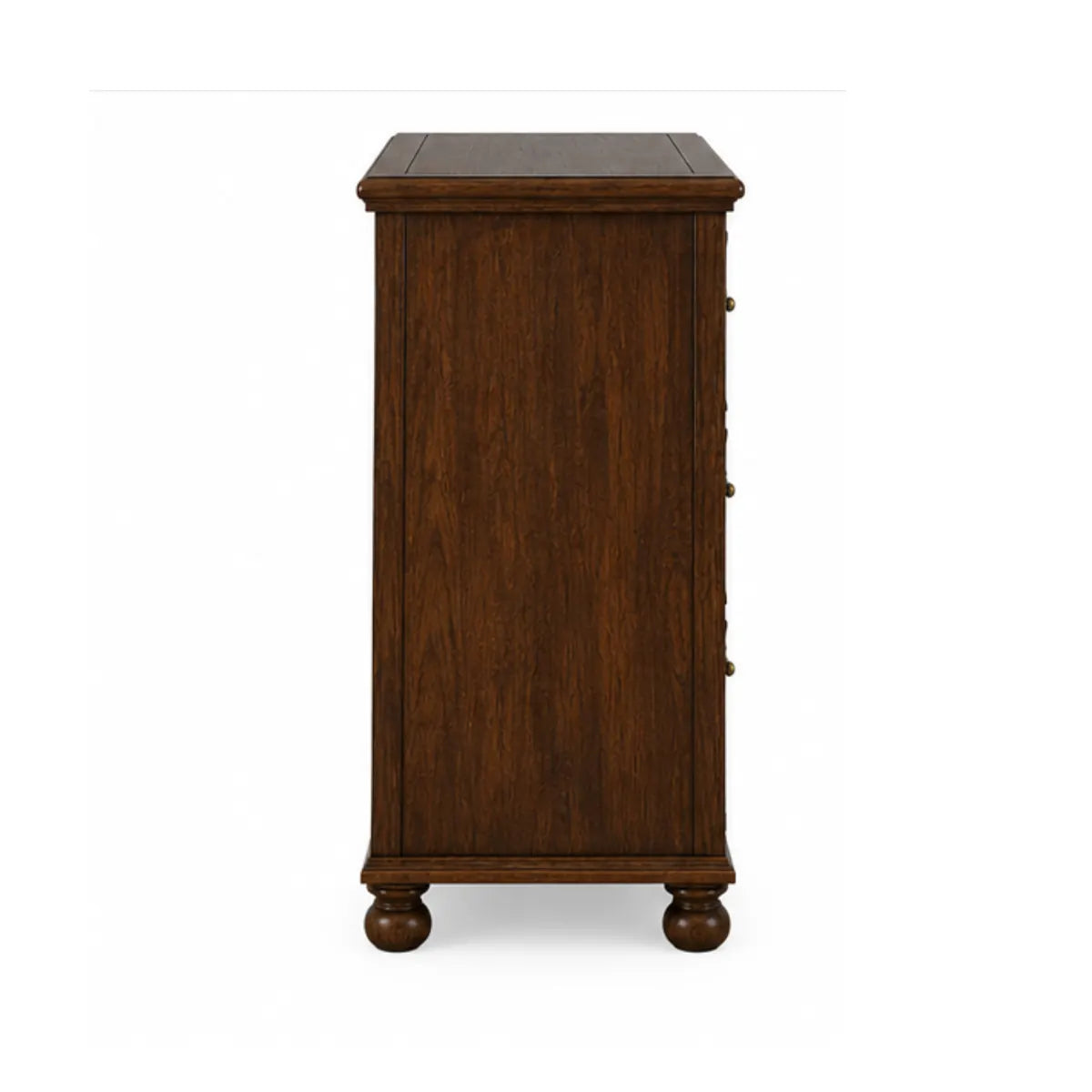 Side profile of Winnetka carved dresser showing molded top edge and bun feet